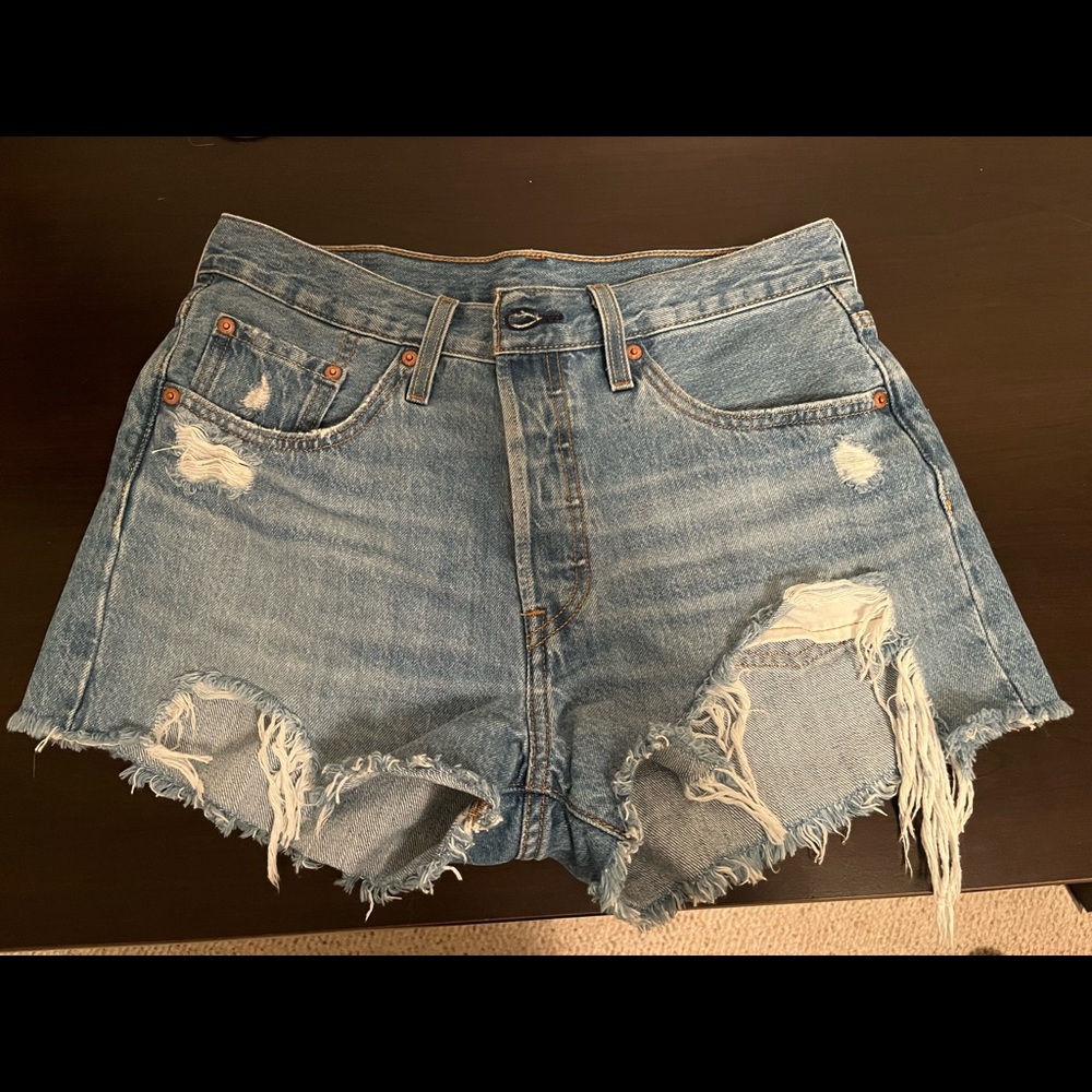 Levi high waisted light wash distressed shorts